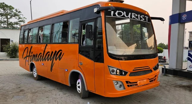 orange painted Luxury bus and Himalaya written on it on front and Sides